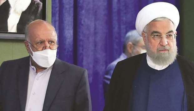 This handout photograph released by the Iranian Presidentu2019s Office shows President Hassan Rouhani (right) and Oil Minister Bijan Namdar Zanganeh, arriving to inaugurate the Jask oil terminal, in the capital Tehran yesterday. (AFP)