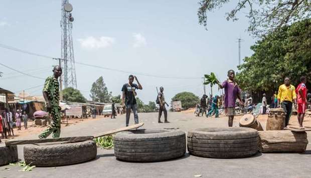 Protesters erect makeshift barricades with tires and branches during a demonstration against Benin President Patrice Talon in Toui, an opposition stronghold on April 7.