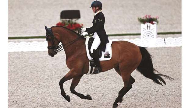 Australiau2019s Mary Hanna rides Calanta in the dressage individual grand prix Group A during the equestrian competition. (AFP)