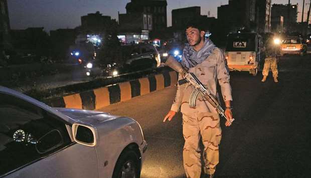 A security personnel stops a vehicle at a check point in Herat yesterday, as a night curfew was imposed across 31 of the countryu2019s 34 provinces to curb surging violence unleashed by a sweeping Taliban offensive in recent months.