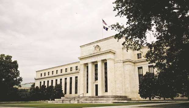 The Federal Reserve building in Washington, DC. As rising prices and the spread of new Covid-19 variants increase risks to the US economy, Fed officials are expected to maintain their easy money policies intended to help American companies and workers survive the pandemic damage.
