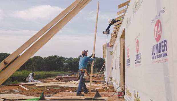Contractors work on a home under construction in Sumter, South Carolina, US. Policy hawks at the Federal Reserve are setting their sights on scaling back the US central banku2019s massive intervention in the mortgage market as home prices soar.