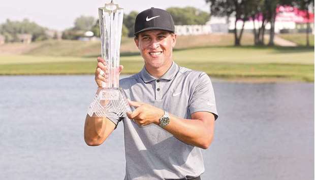 Cameron Champ poses with the trophy after winning the 3M Open at TPC Twin Cities in Blaine, Minnesota. (Getty Images/AFP)