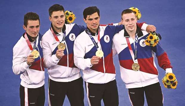(From left) Gold medallists Russiau2019s David Belyavskiy, Nikita Nagornyy, Artur Dalaloyan and Denis Abliazin celebrate after winning the artistic gymnastics menu2019s team event at the Tokyo 2020 Olympic Games in Tokyo yesterday. (AFP)
