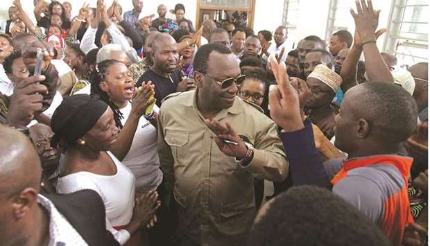File photo taken on March 10, 2020 shows Freeman Mbowe (centre), chairman of Chadema, Tanzaniau2019s main opposition party, arrive at Kisutu Magistrate Court in Dar es Salaam, Tanzania.