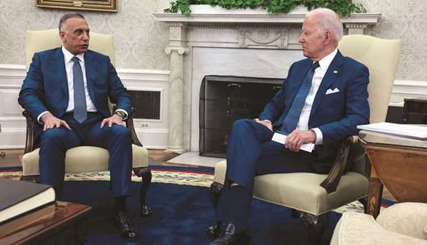 US President Joe Biden listens to Iraqu2019s Prime Minister Mustafa al-Kadhimi during a bilateral meeting in the Oval Office at the White House in Washington, yesterday.