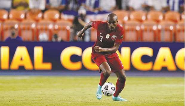 Qatar defender Abdelkarim Hassan dribbles the ball downfield during the Concacaf Gold Cup match against Honduras at BBVA Stadium in Houston, Texas. (AFP)
