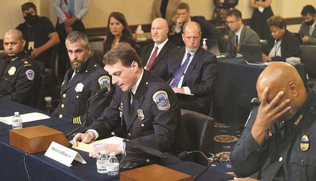 Aquilino Gonell, sergeant of the US Capitol Police; Michael Fanone, officer for the Metropolitan Police Department; and Harry Dunn, private first class of the US Capitol Police, listen while Daniel Hodges, officer for the Metropolitan Police Department, testifies during a hearing of the House select committee investigating the January 6 attack on Capitol Hill in Washington, US, yesterday.