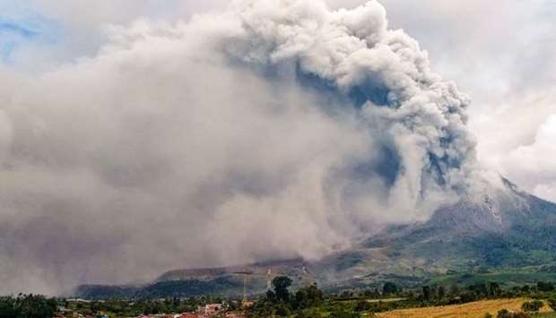 Mount Sinabung erupts spewing a massive column of smoke and ash as seen from Karo, North Sumatra