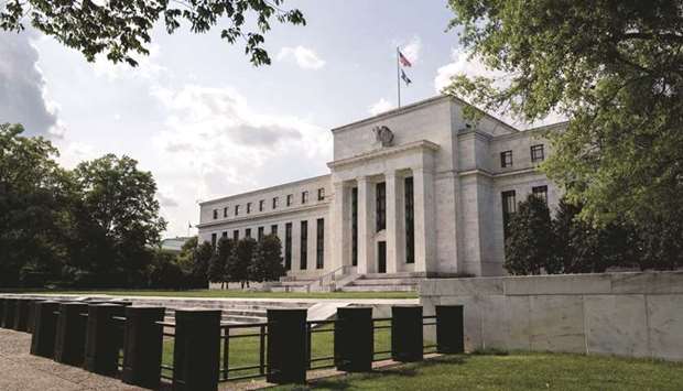 The Federal Reserve building in Washington, DC. The Fed kept the target range for its benchmark policy rate unchanged at zero to 0.25% yesterday and adjusted language to say that it had pledged in December to continue asset purchases at a $120bn monthly pace until u201csubstantial further progressu201d had been made on employment and inflation.