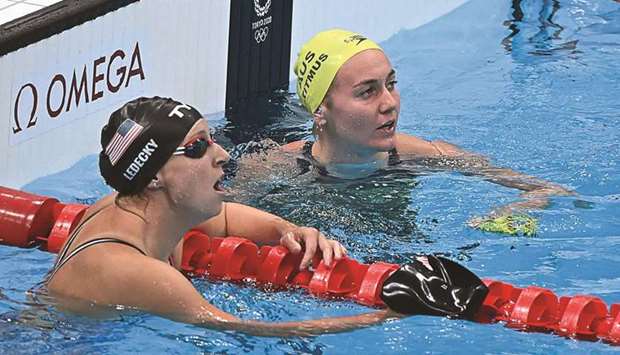 Australiau2019s Ariarne Titmus (right) reacts next to USAu2019s Kathleen Ledecky after winning the final of the womenu2019s 200m freestyle during the Tokyo Games yesterday. (AFP)