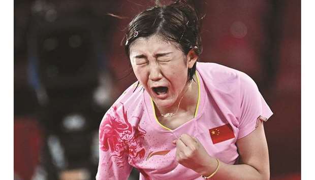 Chinau2019s Chen Meng celebrates after defeating compatriot Sun Yingsha in the womenu2019s singles table tennis final at the Tokyo Games. (AFP)