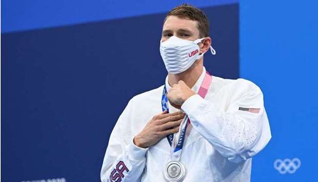 Silver medallist USA's Ryan Murphy poses with his medal after the final of the men's 200m backstroke swimming event during the Tokyo 2020 Olympic Games at the Tokyo Aquatics Centre in Tokyo. AFP