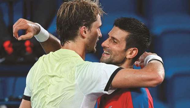 Serbiau2019s Novak Djokovic (right) congratulates Germanyu2019s Alexander Zverev after losing the semi-final match during the Tokyo Olympic Games menu2019s at the Ariake Tennis Park in Tokyo. (AFP)