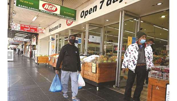 Residents shop for essential goods as people try to manage the Covid-19 restrictions in western Sydney yesterday.