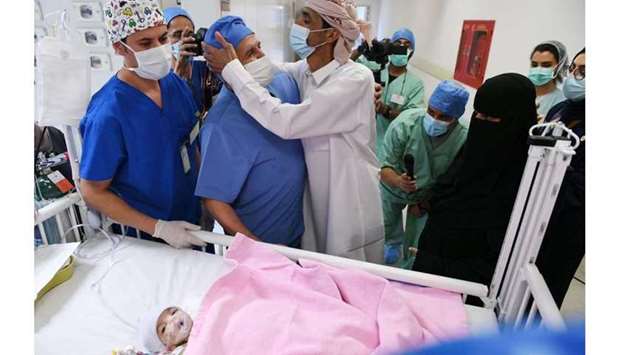 The father of a pair of Yemeni parasite twin Aisha thanking surgeons after the successful surgery to separate his daughter, at the King Abdullah Specialist Children's Hospital located in the King Abdulaziz Medical City, in Saudi Arabia's capital Riyadh on July 28. AFP PHOTO/King Salman Humanitarian Aid and Relief Centre