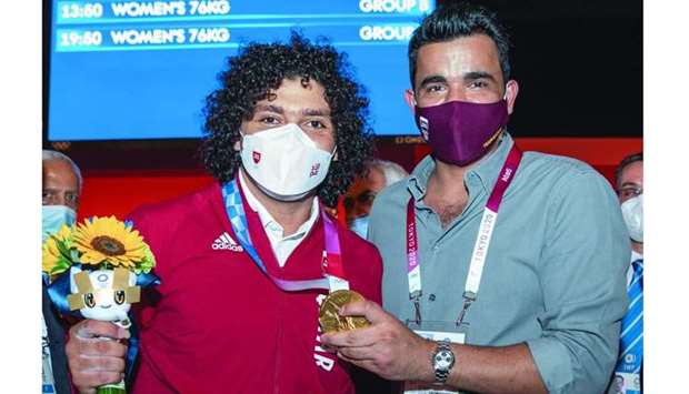 Qatar Olympic Committee President HE Sheikh Joaan bin Hamad al-Thani celebrates with weightlifter Fares Ibrahim, who won gold at the Tokyo Olympics Saturday. PICTURES: Salem al-Saadi