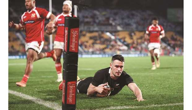 Will Jordan of New Zealand scores a try during the rugby Test against Tonga in Auckland yesterday. (AFP)