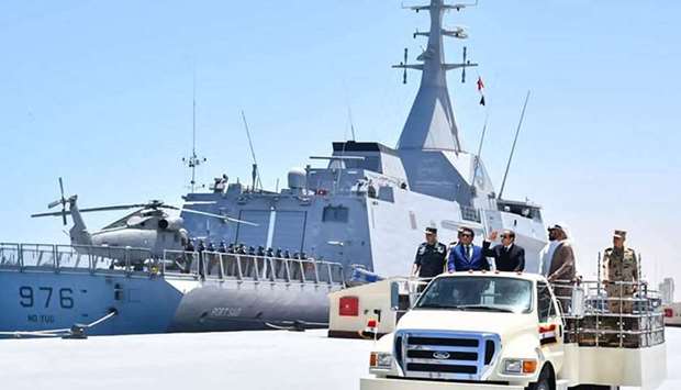 Egyptian President Abdel Fattah al-Sisi riding in a vehicle next to a warship during the inauguration of the new ,July 3, naval base in Gargoub. AFP/HO/EGYPTIAN PRESIDENCY