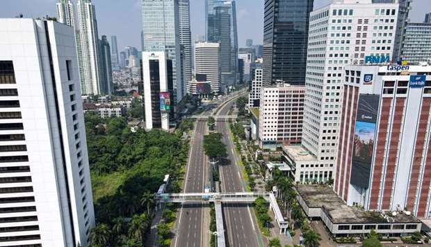 This aerial picture shows streets partly deserted in Jakarta as Indonesia imposed a partial lockdown in the capital due to the Covid-19 coronavirus Delta variant.