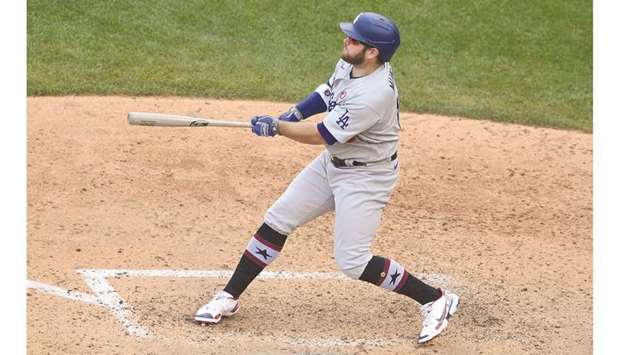 Max Muncy of the Los Angeles Dodgers doubles in two runs in the seventh inning during a baseball game against the Washington Nationals at Nationals Park in Washington, DC. (Getty Images/AFP)