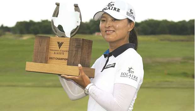 Jin Young Ko of Korea poses with the trophy after winning the Volunteers of America Classic at the Old American Golf Club in The Colony, Texas. (Getty Images/AFP)