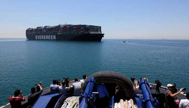 Ever Given, one of the world's largest container ships, is seen at the Suez Canal after the canal authority reached a settlement with the vessel's owner and insurers, in Egypt's Great Bitter Lake in Ismailia, Egypt. Reuters