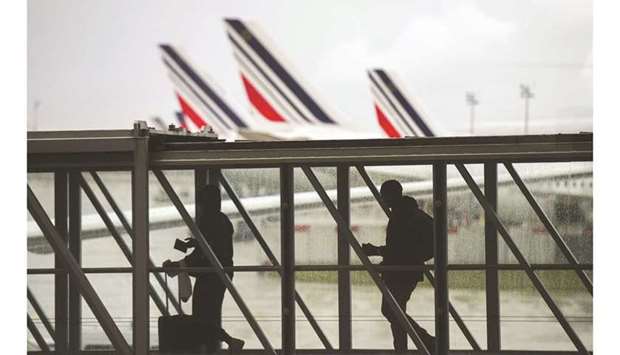Travellers at Charles de Gaulle airport in France. Airlines in the worldu2019s biggest carbon market will eventually have to pay for all the pollution from their planes as the European Union strengthens its climate policies under the Green Deal.