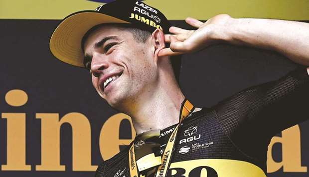 Stage winner Team Jumbo Vismau2019s Wout van Aert of Belgium celebrates on the podium after winning the 11th stage of the 108th edition of the Tour de France cycling race, 198km between Sorgues and Malaucene, yesterday. (AFP)