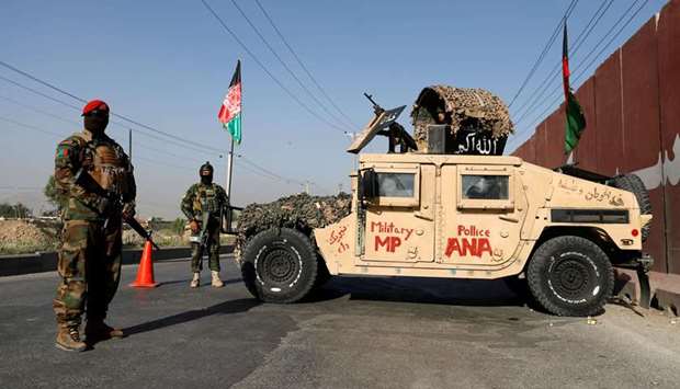 Afghan National Army officers keeps watch at a chek point in Kabul, Afghanistan