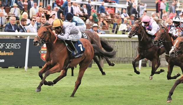 Jockey Pat Dobbs rides Lusail to victory at the Group Two Tattersalls July Stakes at Newmarket, England, on Thursday. (Racing Post)