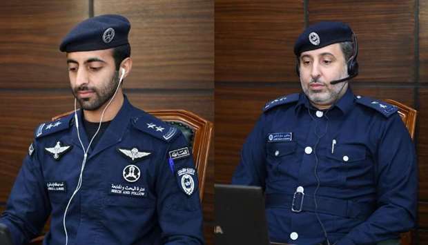First Lieutenant Ahmed Abdullah Salem Ghurab al-Marri, Officer of the Follow Up and Technical Office at Search and Follow Up Department, left, and First Lieutenant Abdul Azeez Saleh al-Rashedi, Head, Studies and Technical Research Section at the Criminal Evidence and Information Department, centre.