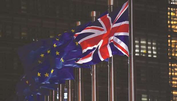 A UK national flag flies beside EU flags outside the Berlaymont building in Brussels. Accounts publi