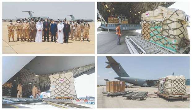Tunisian and Qatari officials pose for a picture as Qatari Amiri Air Force planes carrying medical aid, including a 200-bed field hospital and 100 ventilators, arrive in Tunis on Friday.