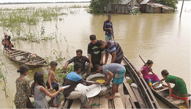 Volunteers distribute relief in the flood-affected Sunamganj region in Bangladesh.