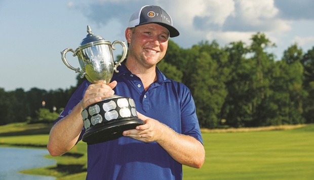 Trey Mullinax celebrates with the Barbasol Championship trophy. (USA TODAY Sports)