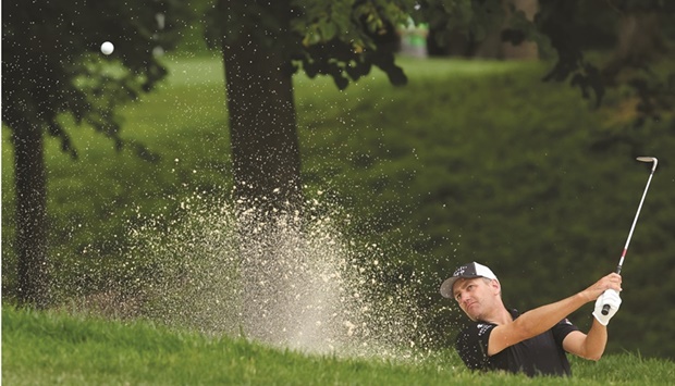 Brendon Todd of the US plays a shot from a bunker on the ninth hole during the second round of the John Deere Classic at TPC Deere Run in Silvis, Illinois. (AFP)