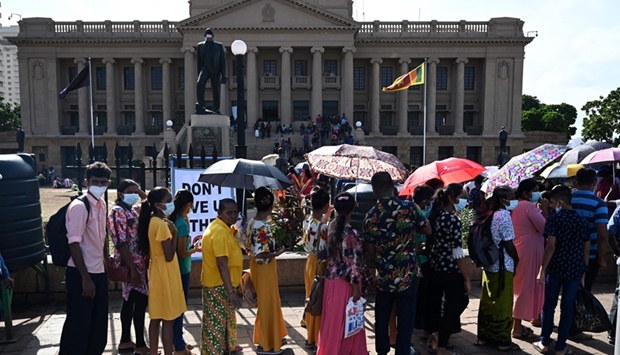  People line up to visit presidential secretariat in Colombo on July 12, 2022, after it was overrun by anti-government protestors.
