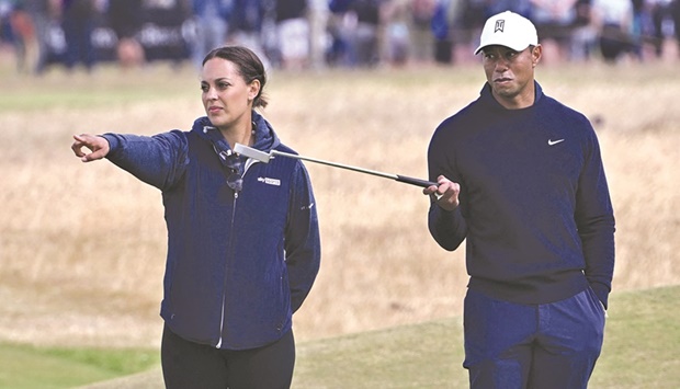 Tiger Woods (right) walks the course with Englandu2019s golfer Henni Koyack during a practice round for The 150th British Open Golf Championship on The Old Course at St Andrews in Scotland. (AFP)