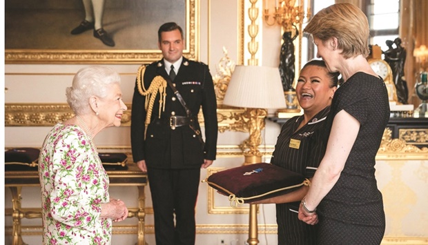 Queen Elizabeth II presents the George Cross to NHS England chief executive Amanda Pritchard (right), and May Parsons, Modern Matron at University Hospital Coventry and Warkwickshire during an audience at Windsor Castle, west of London.