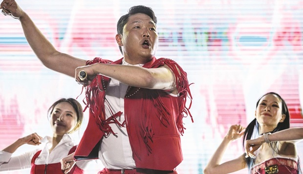 In this picture taken on May 27, 2022, South Korean rapper Psy performs his song Gangnam Style during an outdoor concert at the Korea University in Seoul.