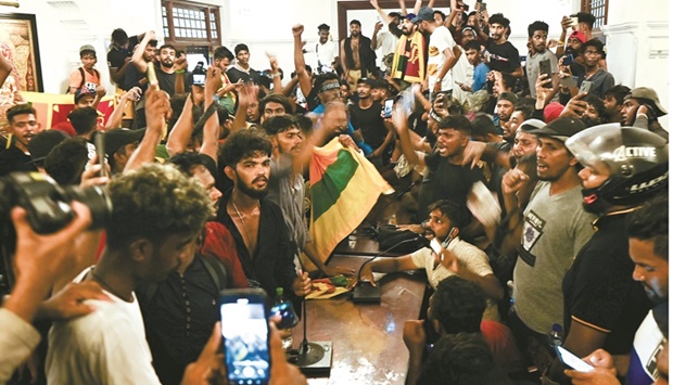 Demonstrators shout slogans inside the office building of Sri Lankau2019s prime minister during an anti-government protest in Colombo.