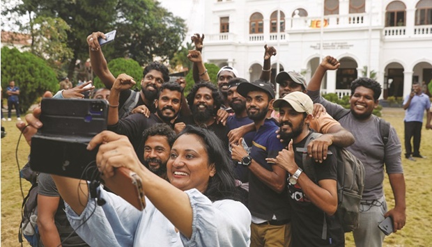 Protesters takes a u2018wefieu2019 before vacating Sri Lanka Prime Minister Ranil Wickremesingheu2019s office in Colombo.