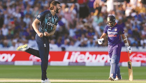 Englandu2019s Reece Topley celebrates after taking the wicket of Indiau2019s Mohamed Shami during the second One Day International at Lordu2019s Cricket Ground, London, Britain, yesterday. (Reuters)