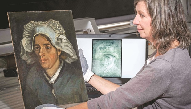 Van Goghu2019s self-portrait, detected under cardboard and glue and Head of a Peasant Woman, are displayed, in Edinburgh.