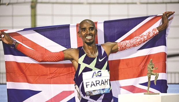 This file photo taken on September 5, 2020, shows Mo Farah celebrating after victory and a world record in the menu2019s one hour event at the Diamond League AG Memorial Van Damme athletics meeting in Brussels.