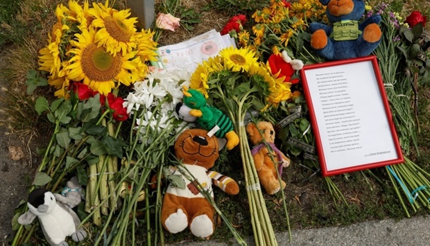 Flowers and toys left by people are seen at a place where 4-years-old girl Liza was killed by a Russian missile strike, as Russia's attack on Ukraine continues, in Vinnytsia, Ukraine. REUTERS