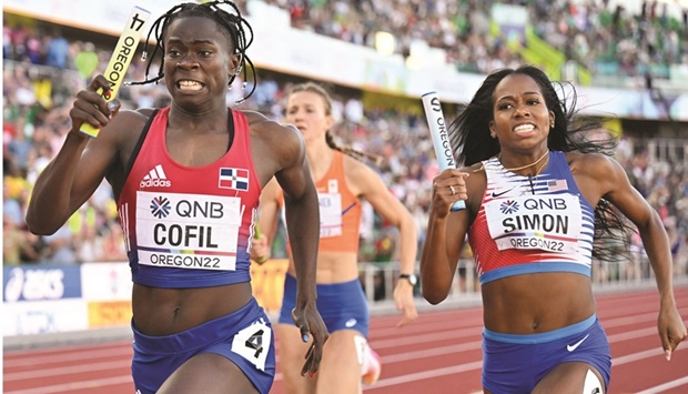 Dominican Republicu2019s Fiordaliza Cofil (left) and USAu2019s Kennedy Simon (right) compete in the mixed 4x400m relay final  during the World Athletics Championships at Hayward Field in Eugene, Oregon, on Friday. (AFP)