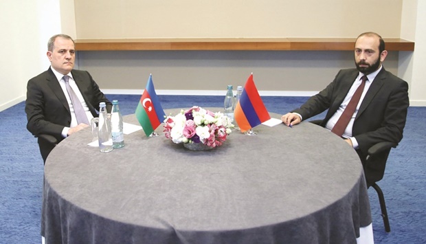 This handout picture released by Georgian Ministry of Foreign Affairs yesterday shows Foreign Minister of Azerbaijan Jeyhun Bayramov (left) and Armenian Foreign Minister Ararat Mirzoyan looking on during a meeting in Tbilisi. (AFP)