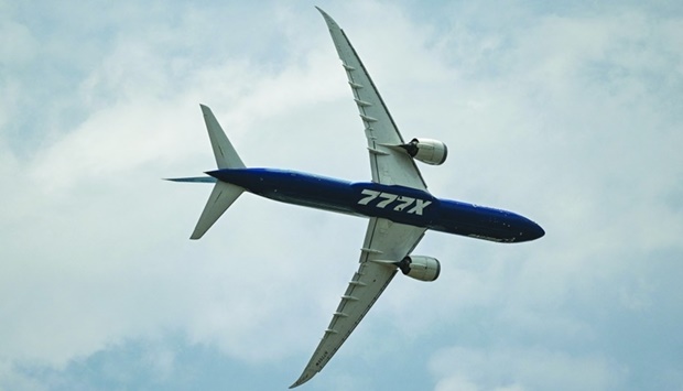 A Boeing 777X plane takes part in the aire show during the Farnborough Airshow, in Farnborough. AFP